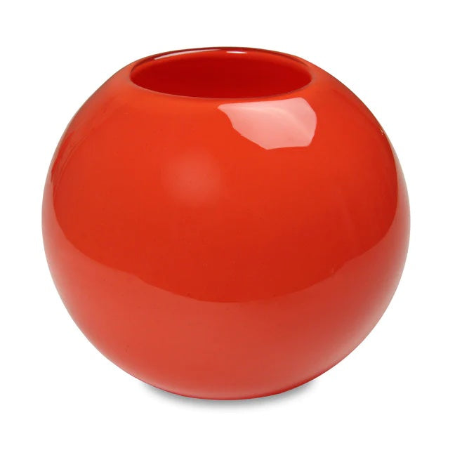 A red globe-shaped glass candle holder