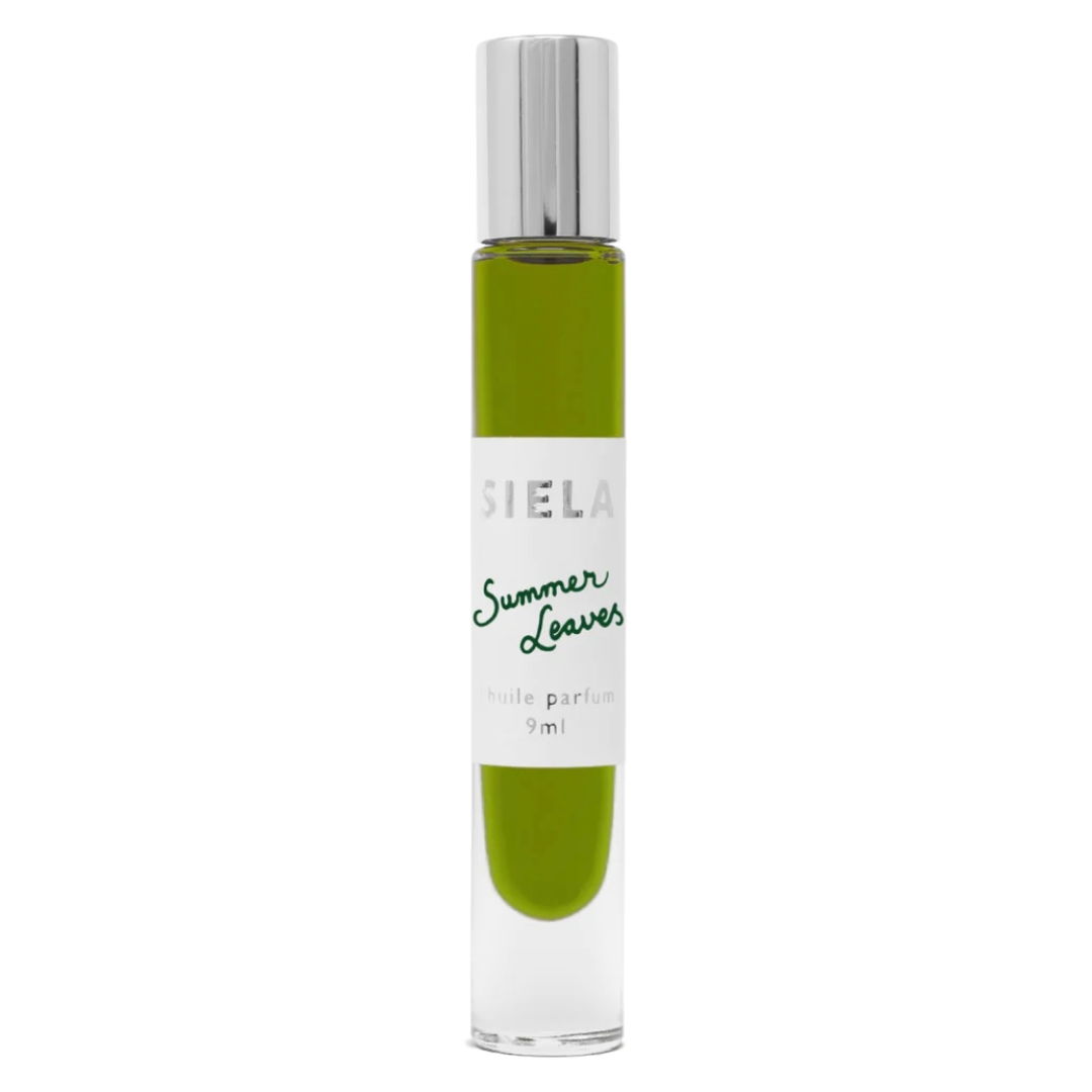 A clear bottle of Siela perfume with green liquid in it and the label 'Summer Leaves eau de parfum 9ml'.