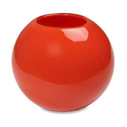 A red globe-shaped glass candle holder