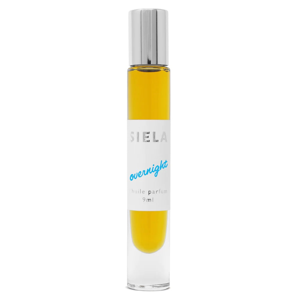 Product of roll-on perfume in clear bottle with silver cap and white label that says 'SIELA OVERNIGHT' and indicating 9ml size.