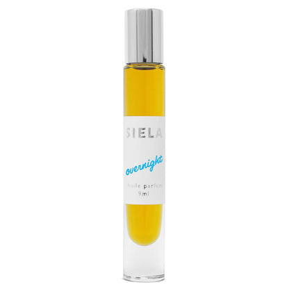 Product of roll-on perfume in clear bottle with silver cap and white label that says 'SIELA OVERNIGHT' and indicating 9ml size.