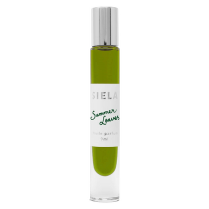 A clear bottle of Siela perfume with green liquid in it and the label 'Summer Leaves eau de parfum 9ml'.