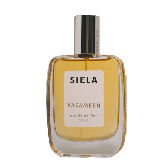 A bottle of Siela perfume labeled 'YASAMEEN' with a capacity indication of 50ml.