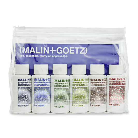A travel kit by Malin+Goetz including various personal care products in small bottles, packaged in a clear bag.