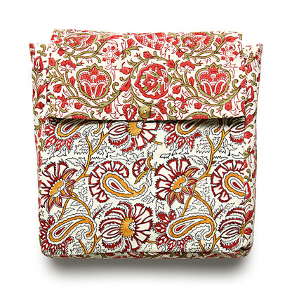 A reversible duvet cover with a floral pattern, featuring red, white, and green colors.