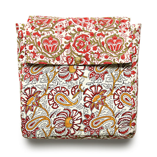 A reversible duvet cover with a floral pattern, featuring red, white, and green colors.
